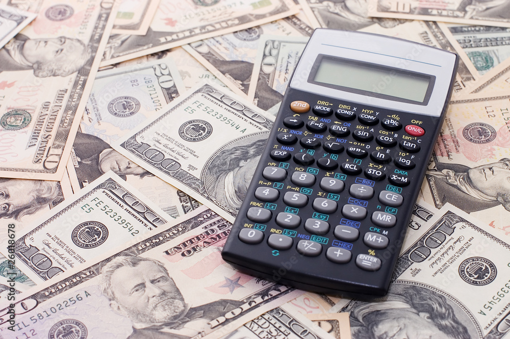 calculator on dollar background - business concept calculator on dollar background - business concept