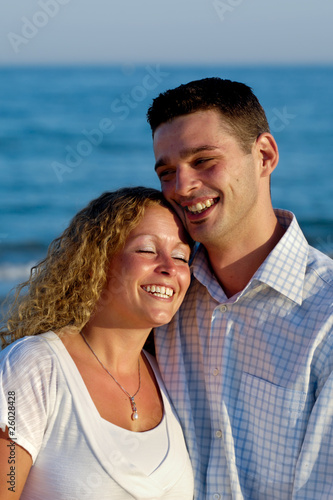 Happy young couple at beach