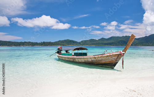 longtail boat and beautiful beach with white sand
