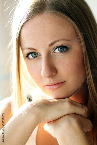 Closeup portrait of a cute young woman photo