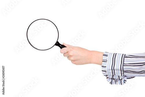 Closeup of womans arm holding a magnifying glass