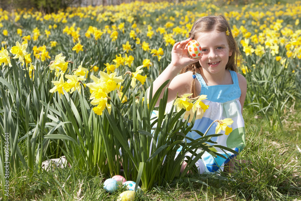 Girl On Easter Egg Hunt In Daffodil Field Girl On Easter Egg Hunt In Daffodil Field