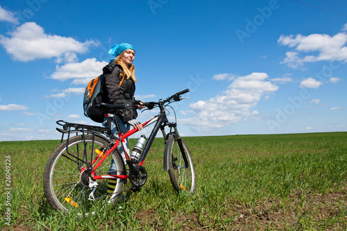 Fototapeta Naklejka Na Ścianę i Meble -  Cool girl riding a bicycle.