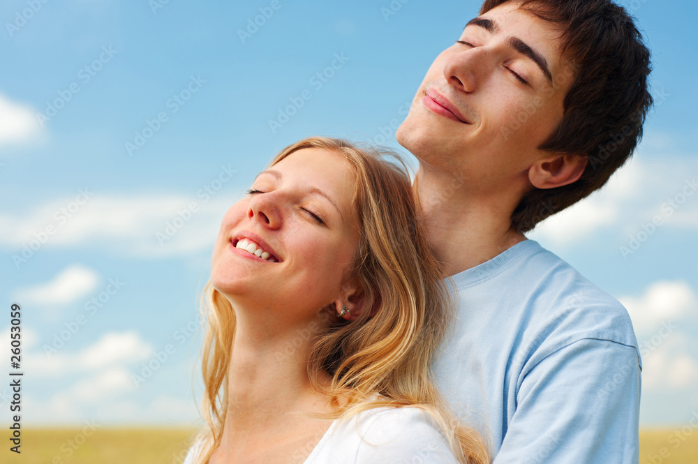 couple relaxing under sun couple relaxing under sun