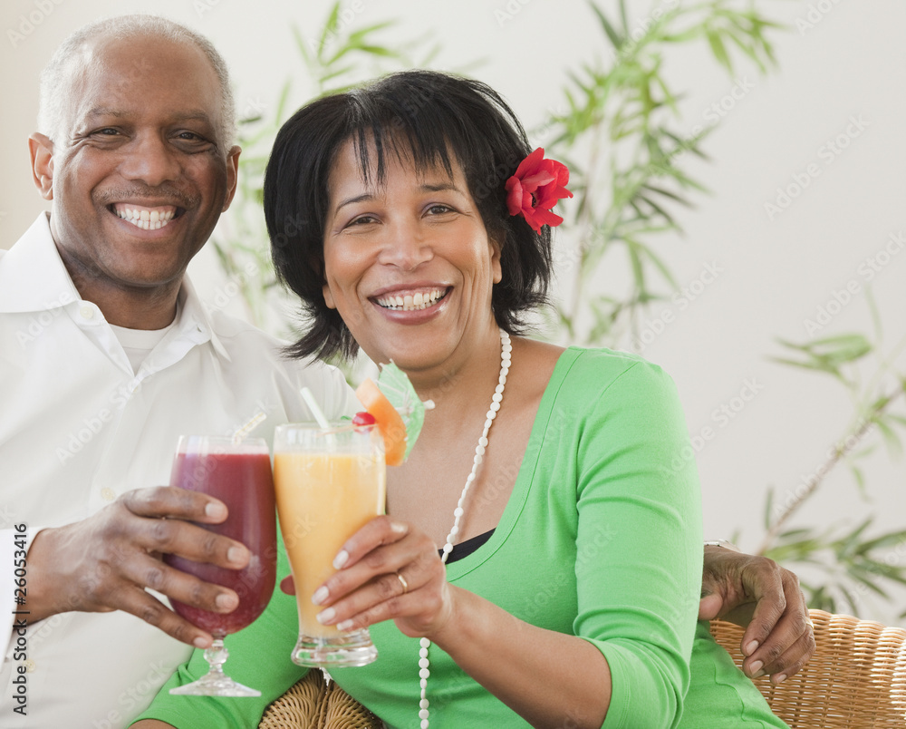 African couple drinking exotic frozen cocktails African couple drinking exotic frozen cocktails