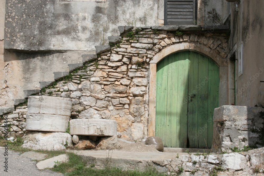 Aged wooden door in an ancient house Aged wooden door in an ancient house