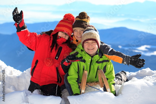 Happy children in snowy Alps