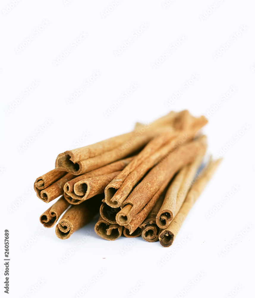 cinnamon sticks on white cinnamon sticks on white