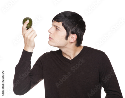 Caucasian man examining a lime photo