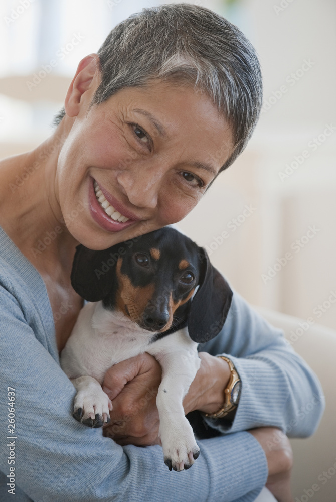 Chinese woman holding dachshund Chinese woman holding dachshund