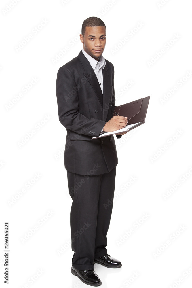 African American businessman isolated on white writing notepad African American businessman isolated on white writing notepad