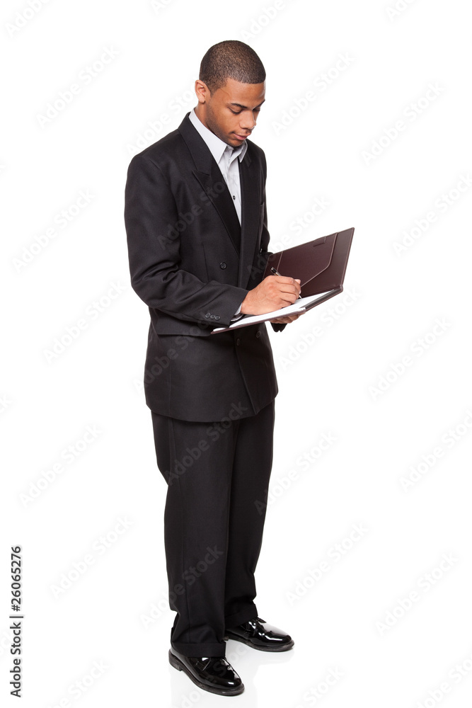 African American businessman isolated on white writing notepad African American businessman isolated on white writing notepad