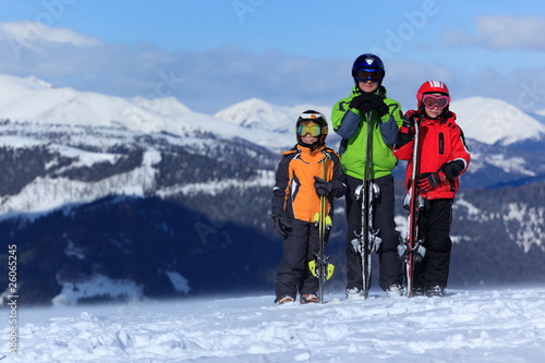 Children with skis on mountain