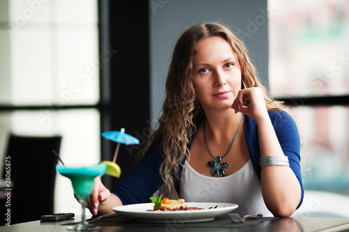 Young woman dining.