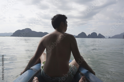 Chinese man on boat in ocean