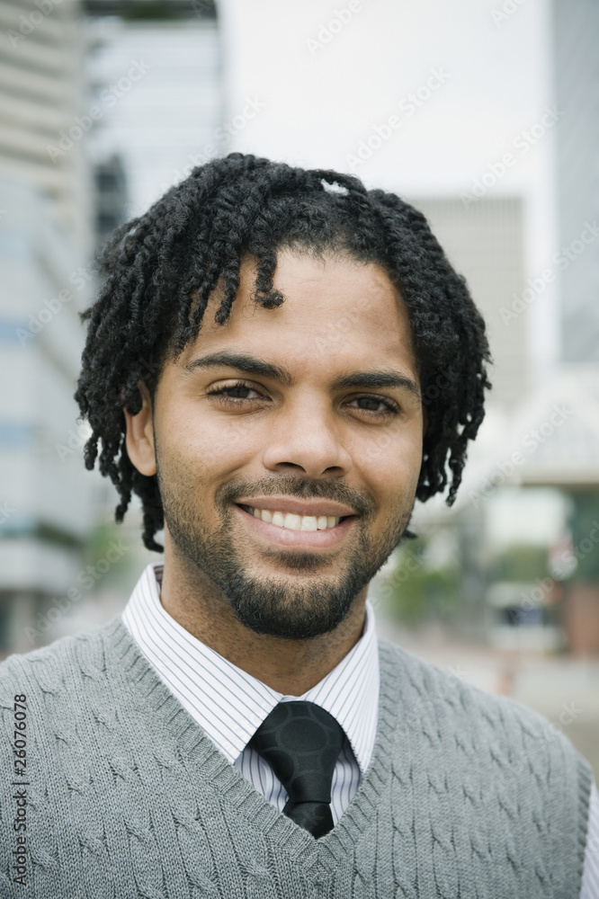 Mixed race businessman smiling Mixed race businessman smiling