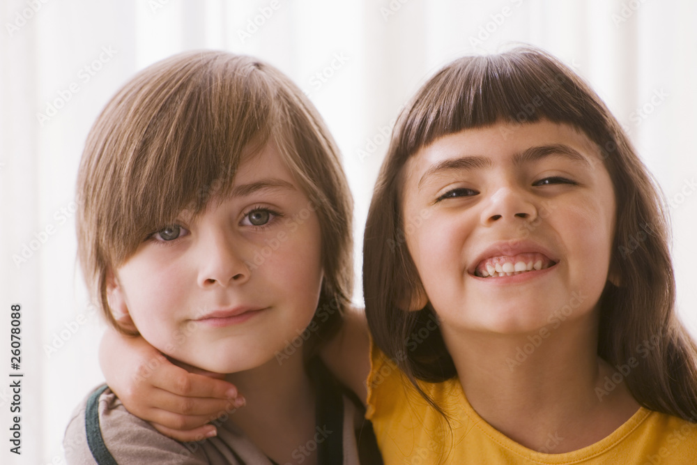 Hispanic boy and girl hugging Hispanic boy and girl hugging