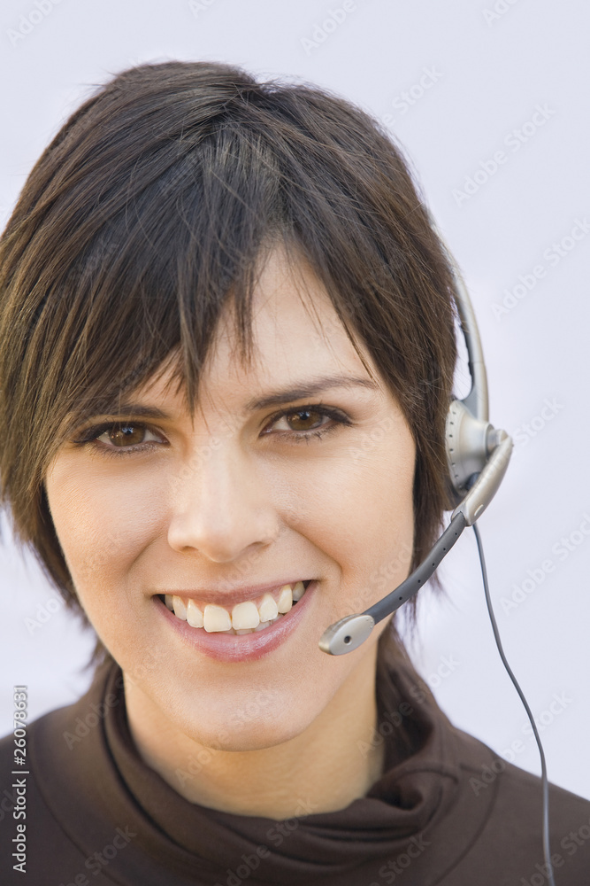 Hispanic businesswoman wearing headset Hispanic businesswoman wearing headset
