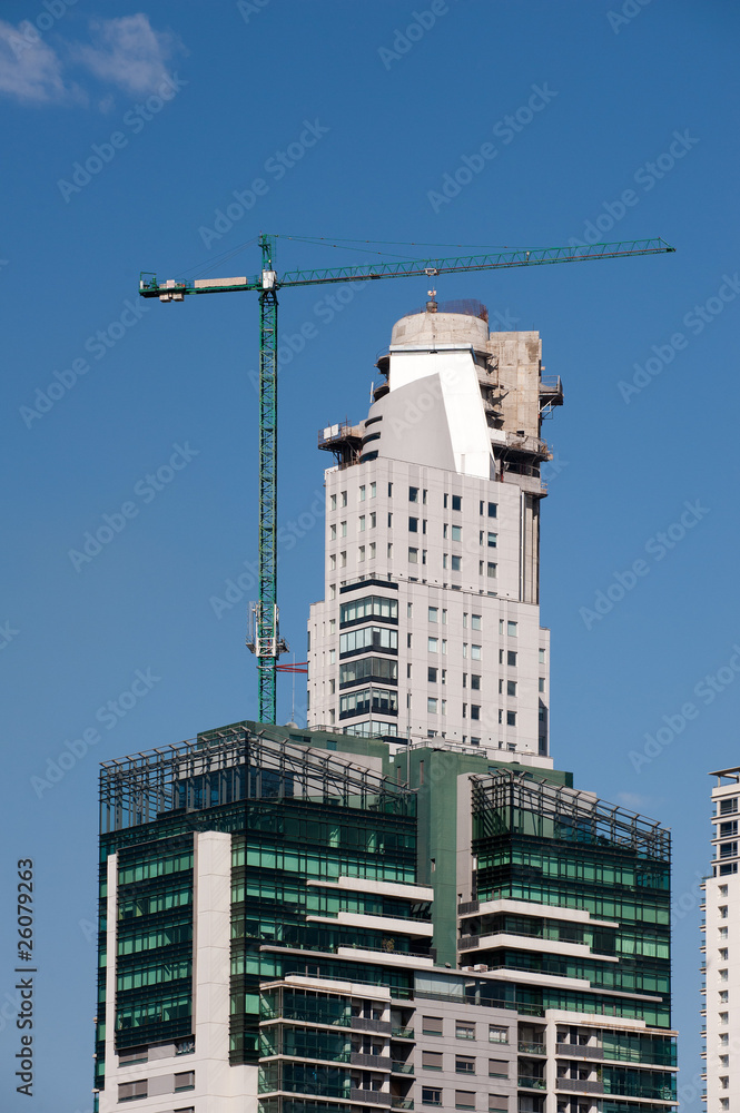 Fototapeta premium Concrete Building Construction with Cranes