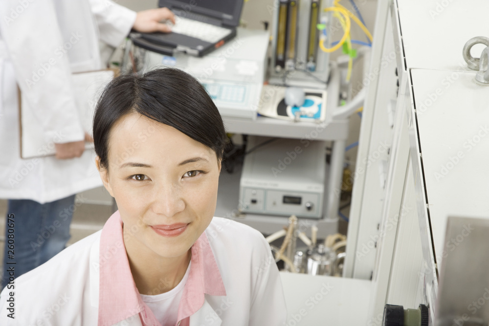 Chinese scientist in laboratory smiling Chinese scientist in laboratory smiling