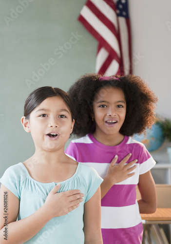 School girls pledging allegiance to the flag