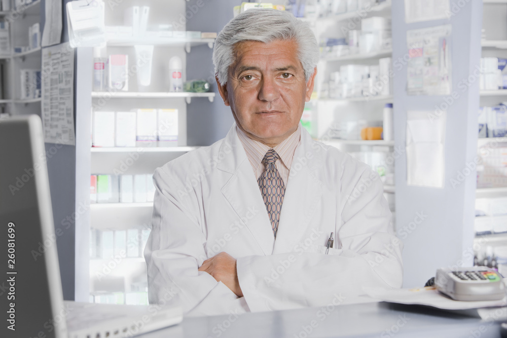 Hispanic pharmacist in drug store Hispanic pharmacist in drug store