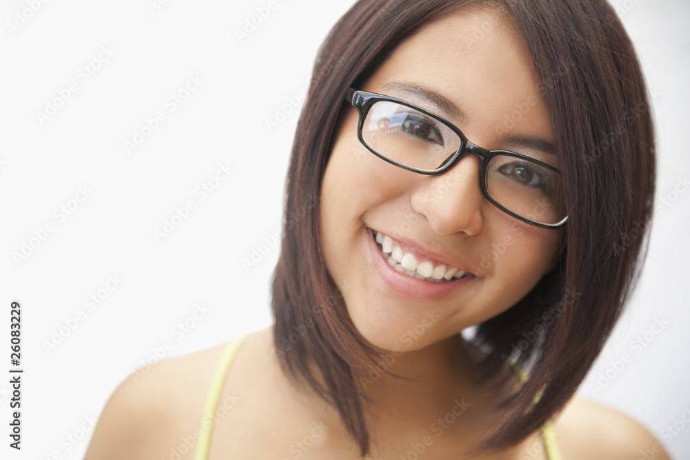 Hispanic teenage girl in eyeglasses smiling Hispanic teenage girl in eyeglasses smiling