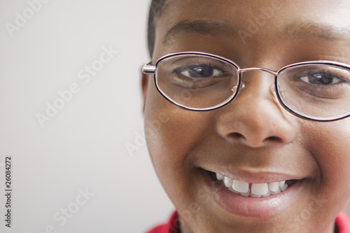 Hispanic boy in eyeglasses smiling