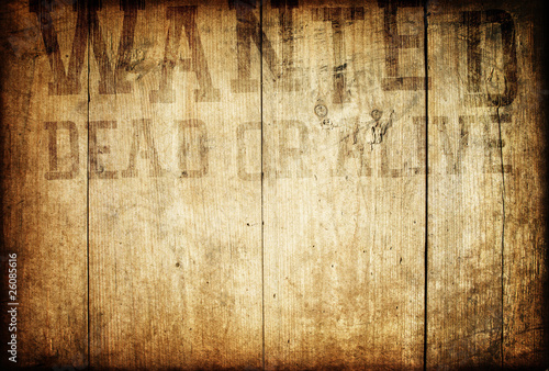 Old western wanted sign on wooden wall.