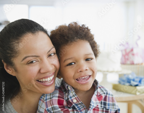 Mixed race mother smiling with son photo