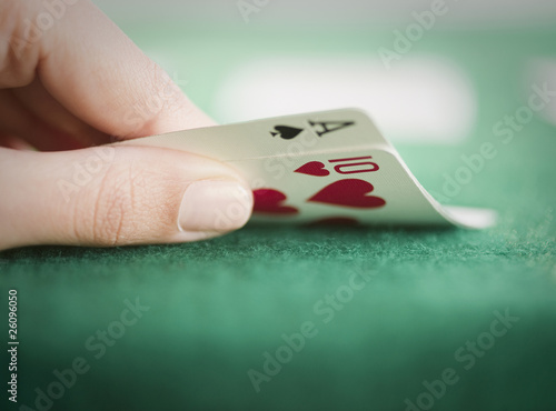 Hand revealing poker cards photo