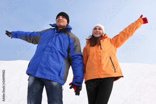 man and girl in sport clothes holding for hands