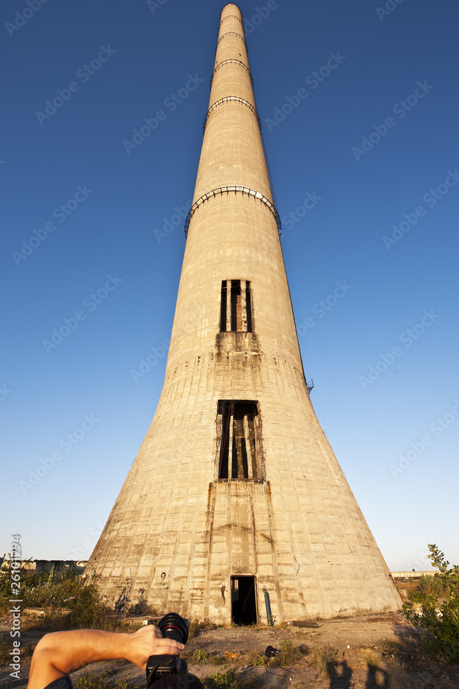 a man photographing a huge tower