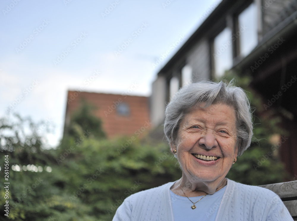 Senior Woman Sitting in Front of Her House 2 Senior Woman Sitting in Front of Her House 2