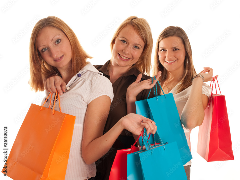 Three cute girls with shoping bags isolated Three cute girls with shoping bags isolated