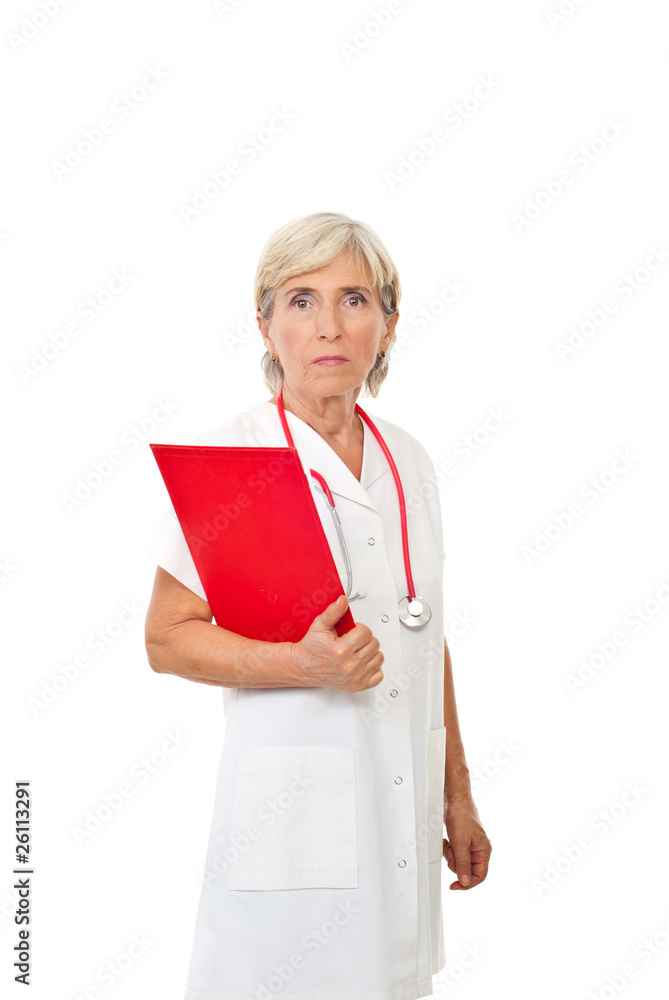 Serious aged doctor with clipboard Serious aged doctor with clipboard