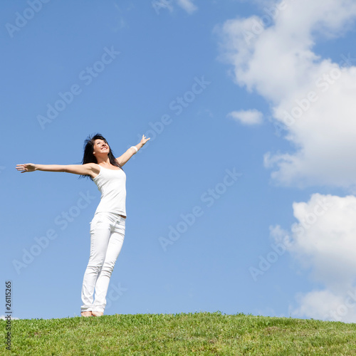 happy young woman dreams to fly on winds