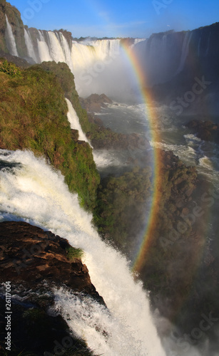 Igaucu falls with rainbow and rocks portrsit photo