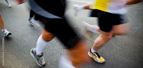 People running in city marathon - motion blur