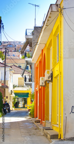 a narrow street surrounded by colorful houses