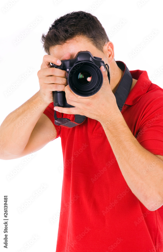 Young male photographer at studio, isolated on white