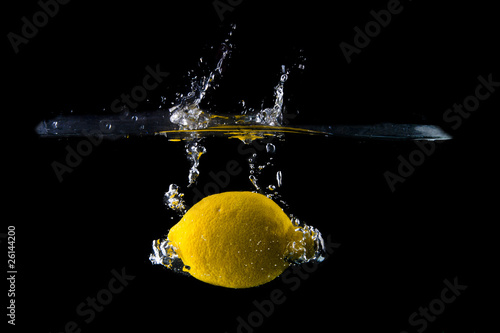 Lemon splash on black background