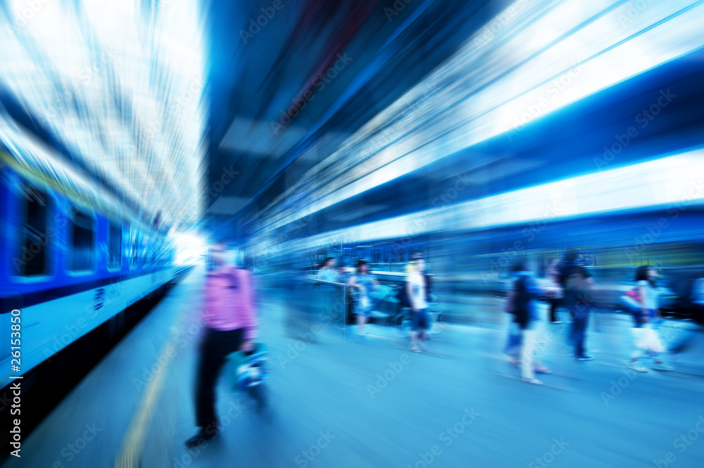 Railway station. Motion blur of people in rush