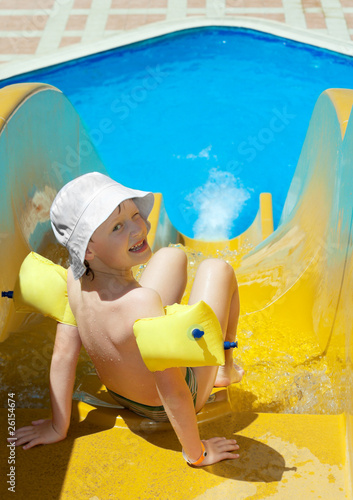 The little boy is going to slide