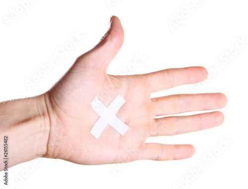 Hand with plaster on palm spreading fingers