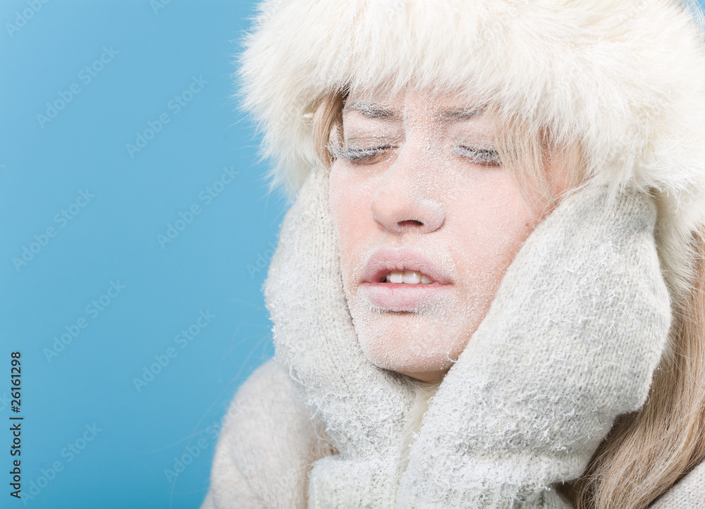 Frozen. Chilled female face covered in snow ice Frozen. Chilled female face covered in snow ice