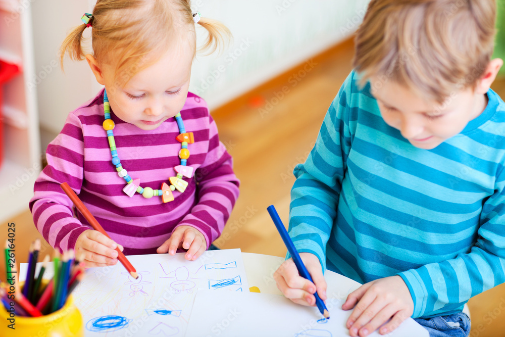 Brother and sister drawing in their room Brother and sister drawing in their room
