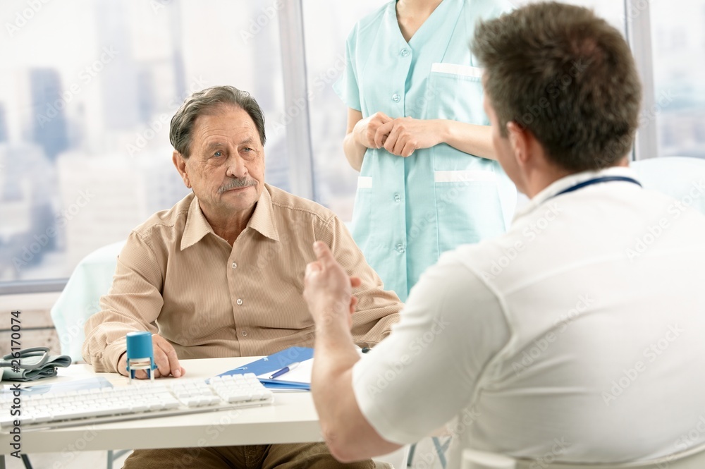 Doctor discussing diagnosis with patient Doctor discussing diagnosis with patient