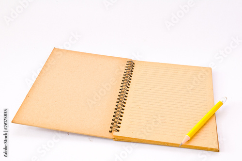 Brown Spiral Notebook with yellow pencil