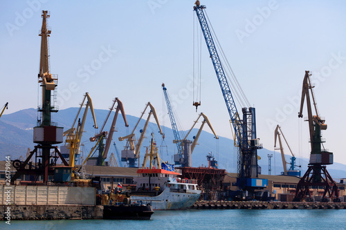 cranes and ships in a port.